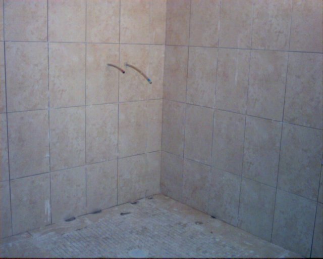 mainbathroomtiledshowerarea.jpg